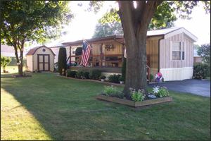 Trailer situated on a cozy lot in Shippensburg, with mature trees